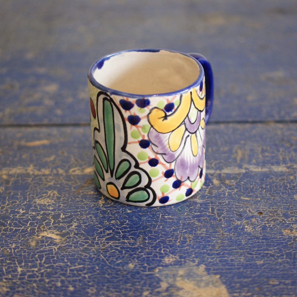 https://zinniafolkarts.com/cdn/shop/files/mexican-talavera-coffee-mugs-ready-to-ship-ceramics-zinnia-folk-arts-multi-with-yellow-and-purple-789615_1024x1024.jpg?v=1700152878