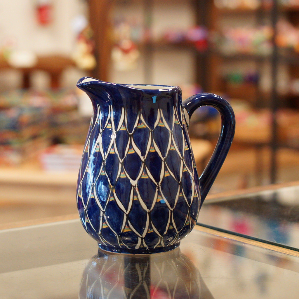 https://zinniafolkarts.com/cdn/shop/files/talavera-water-pitchers-various-designs-ceramics-zinnia-folk-arts-blue-zinnia-981115_1024x1024.jpg?v=1700146628